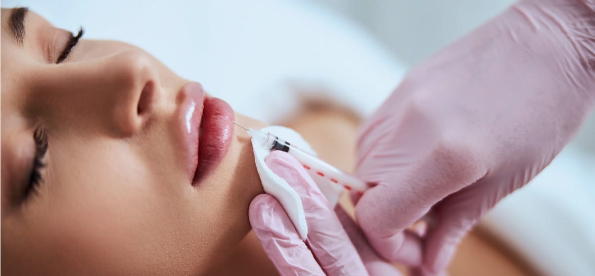 Banner Image showing Client being injected with Dermal Filler to the lips